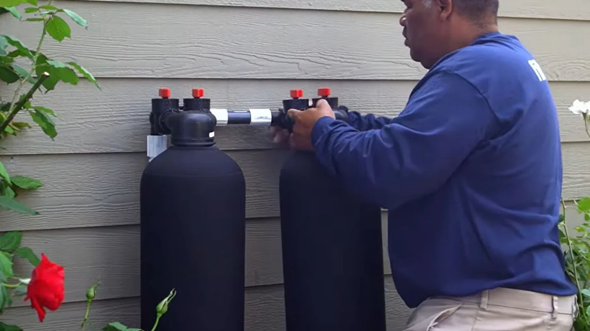 Whole-house water filtration and softener system installed in a Sun City, AZ garage
